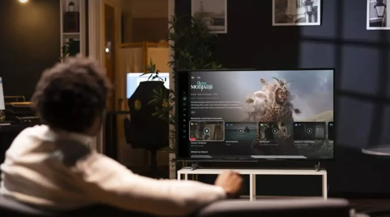 Man watching DStv, a MultiChoice service at home.